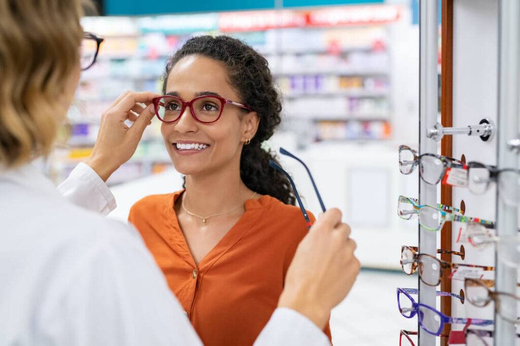 woman trying on astigmatism glasses