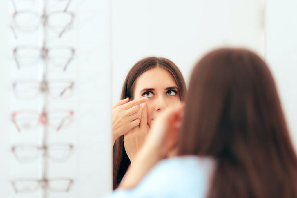 woman taking out her contacts