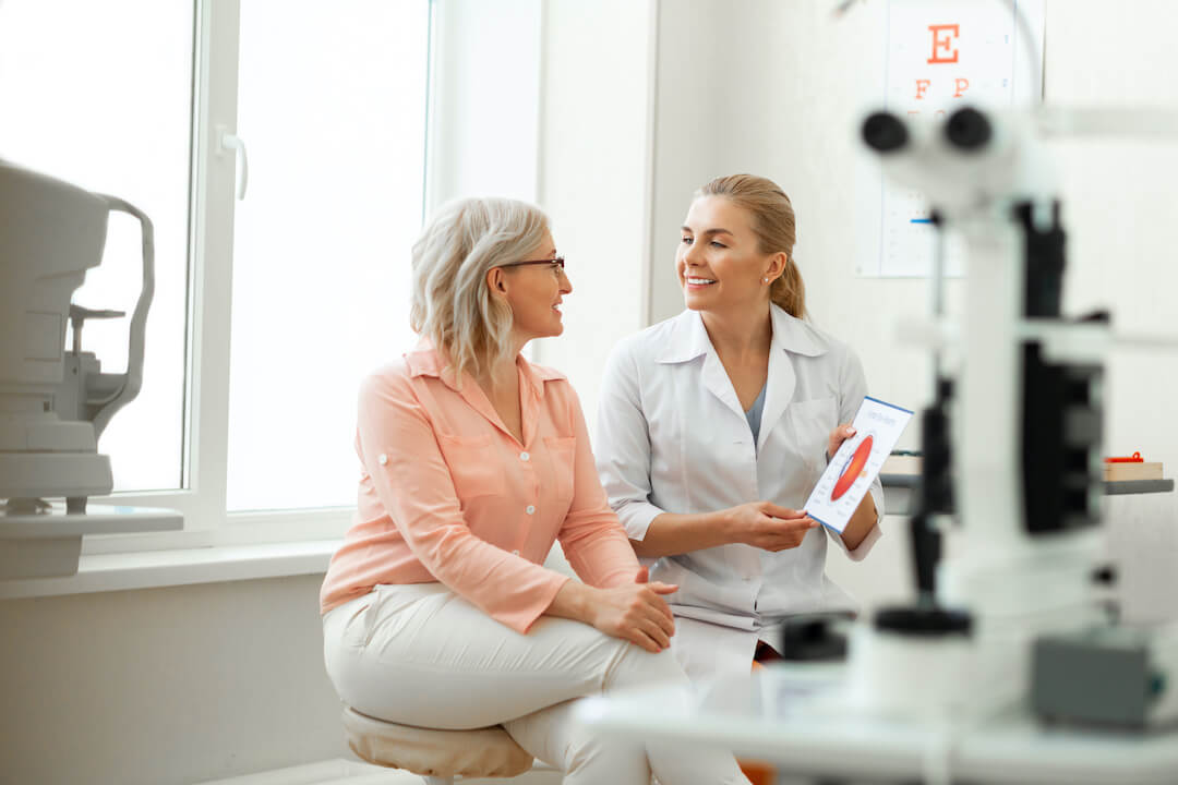 older woman during eye exam for contact lenses for presbyopia