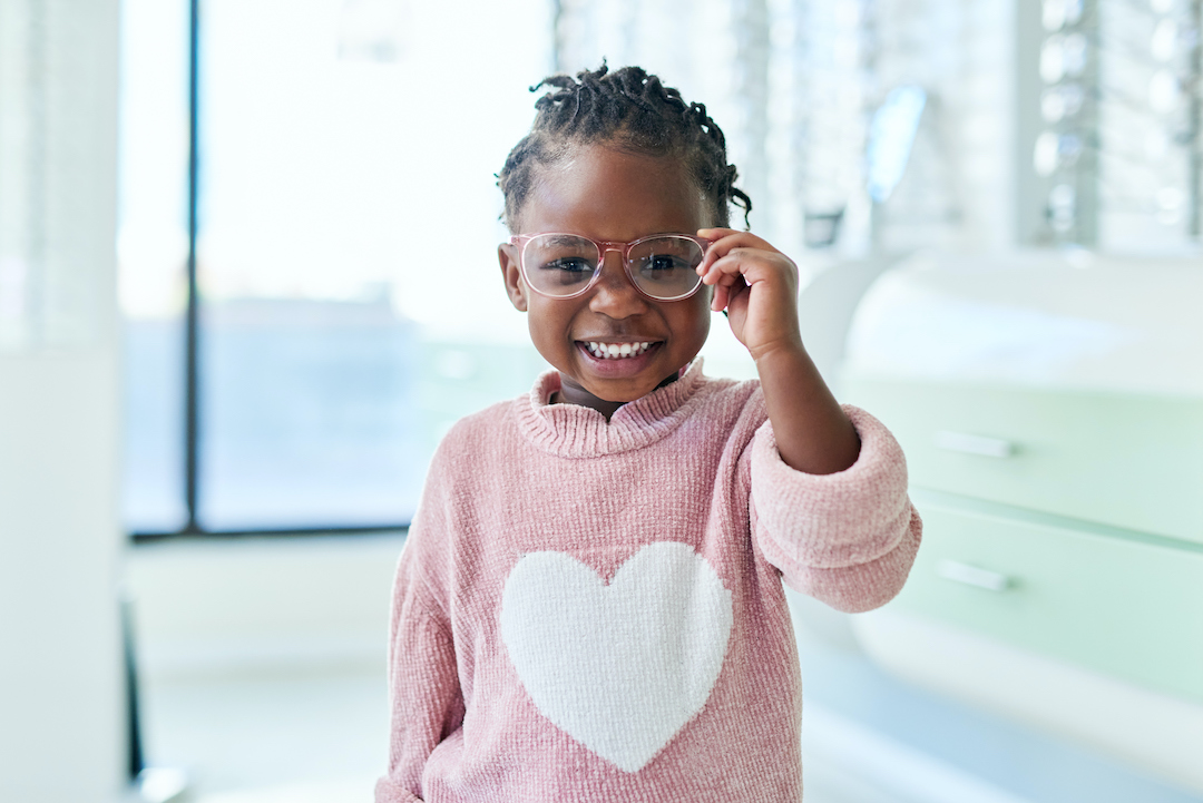 young child wearing glasses