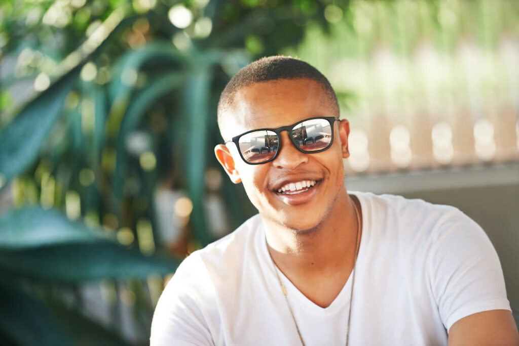 man wearing sunglasses and smiling