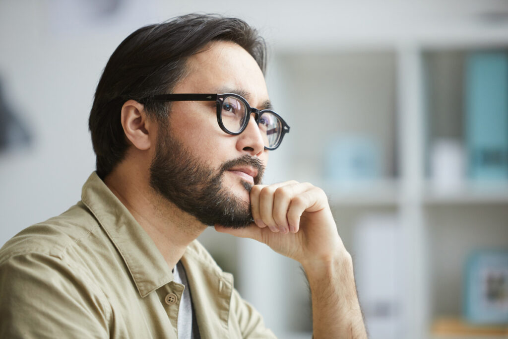 contemplative man wearing glasses