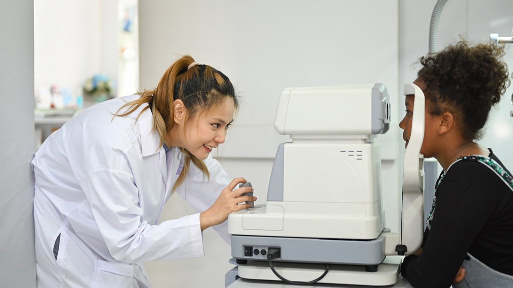 checking eyesight on an auto-refractor machine