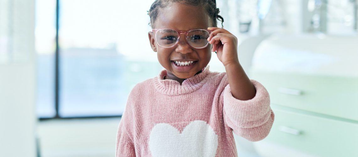 young child wearing glasses