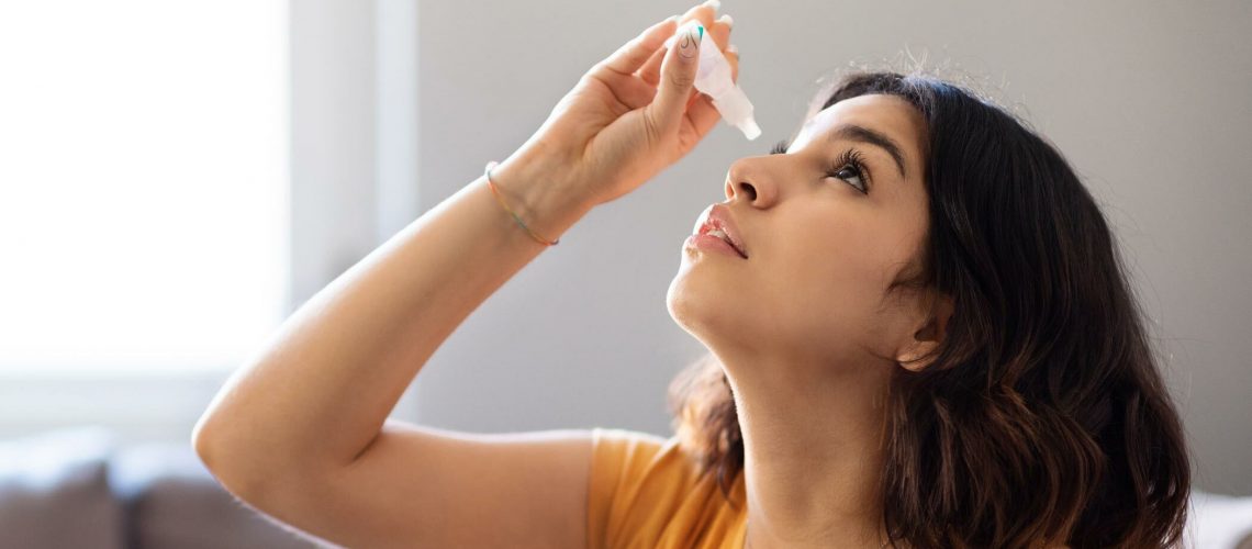 putting in contact lens eye drops